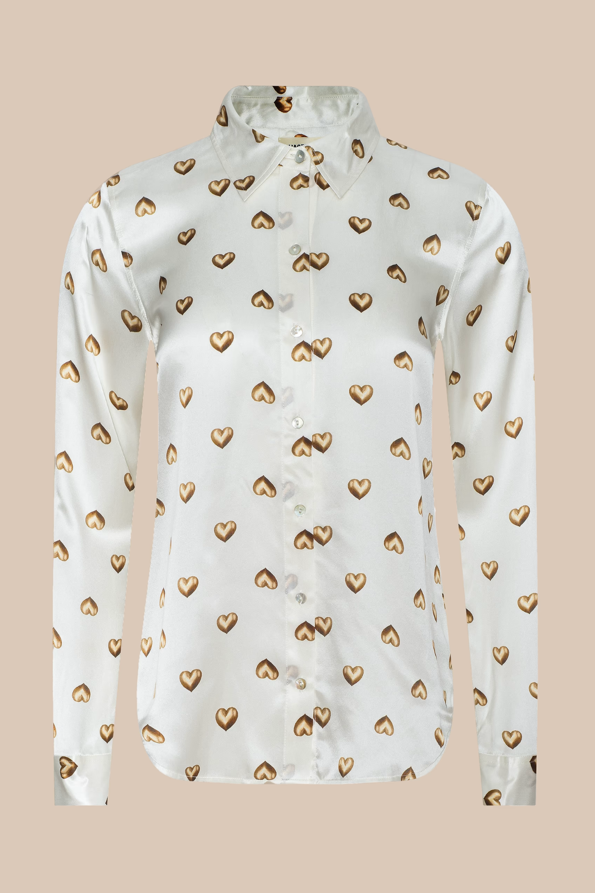 White blouse with gold heart patterns on a beige background