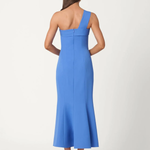 Woman wearing a blue one-shoulder dress on a white background