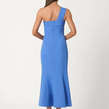 Woman wearing a blue one-shoulder dress on a white background