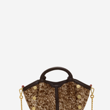 A structured handbag with a brown and gold glittery textured body, dark brown leather trim, top handle, and gold-tone chain strap, shown on a plain light gray background.