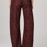 Women's printed full-length pants featuring an etched tulip pattern in rich garnet tones.