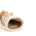 Small decorative bag with a textured surface and visible brand label on a white background
