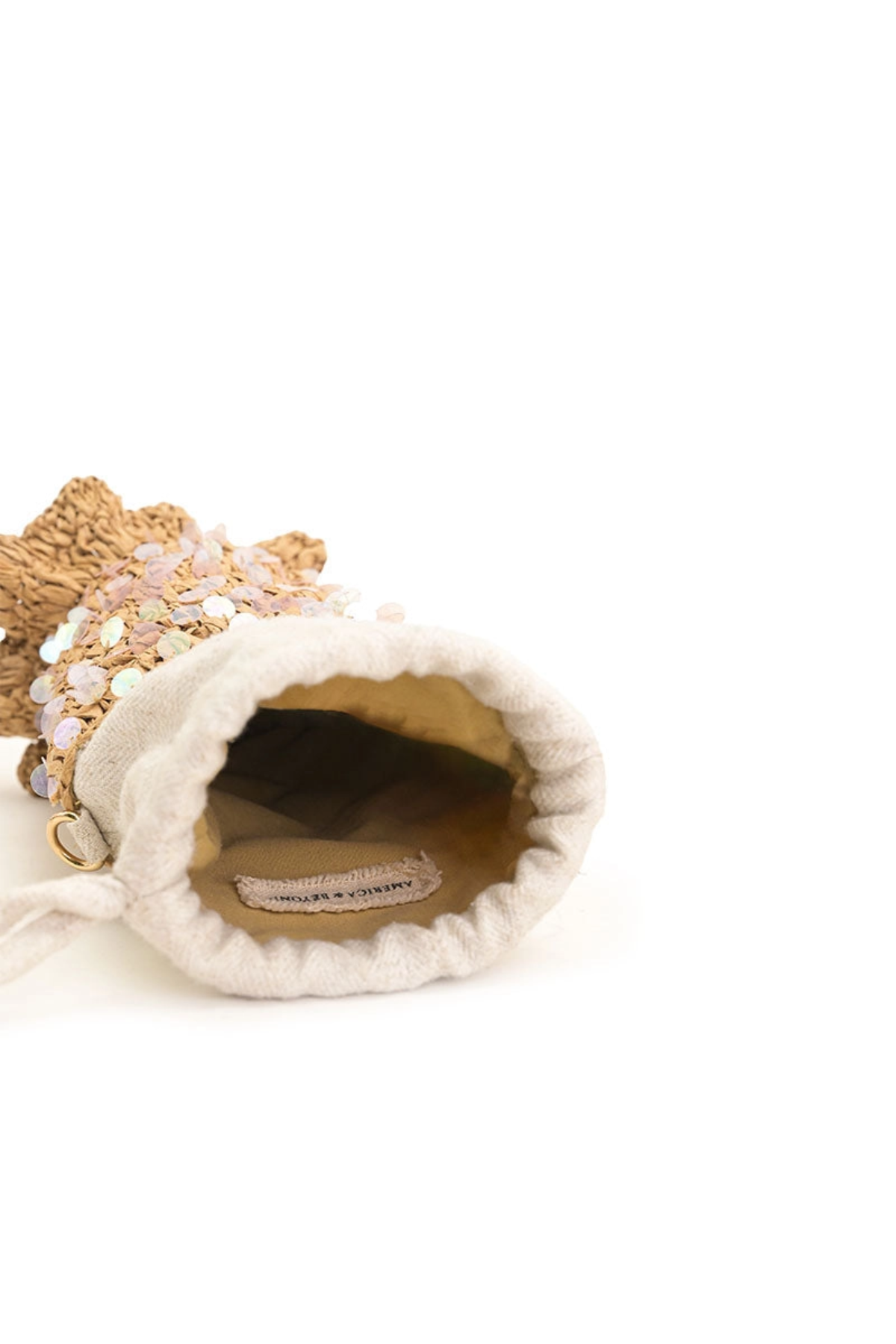 Small decorative bag with a textured surface and visible brand label on a white background