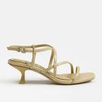 yellow high-heeled sandal on a white background