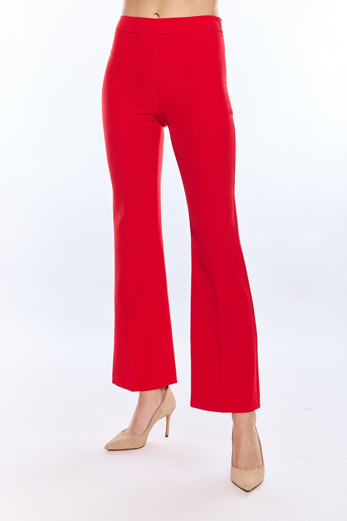 Red pants worn by a person on a white background