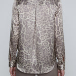 Long-sleeve blouse with a smooth, polished finish.