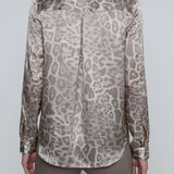 Long-sleeve blouse with a smooth, polished finish.