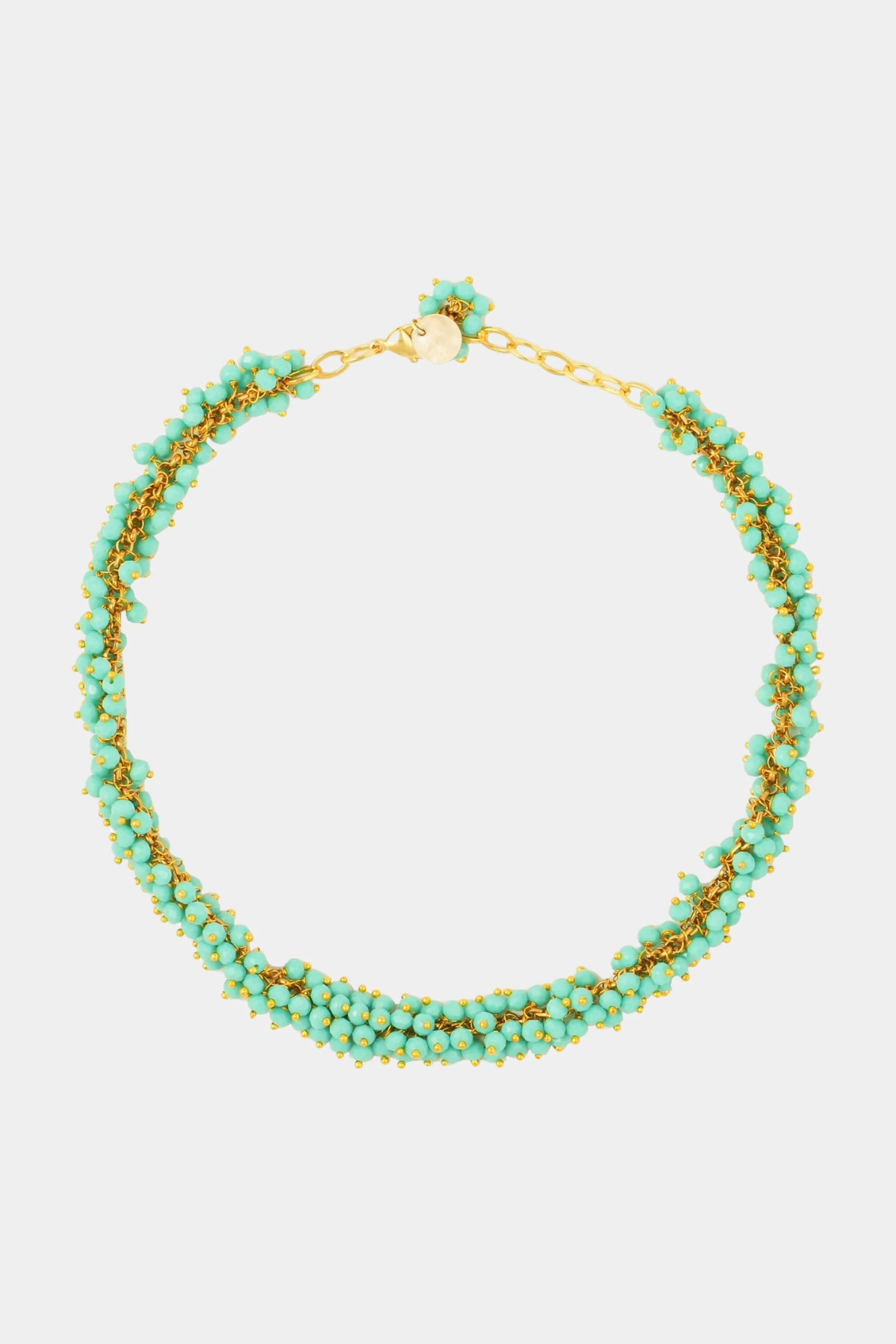 Turquoise beaded necklace with gold accents on a white background