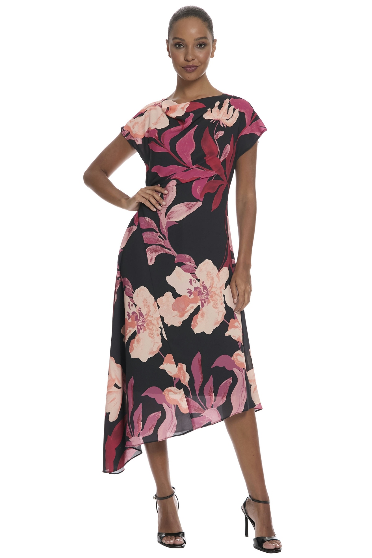 Model wearing a floral printed midi dress with cap sleeves, an asymmetrical hem, and a feminine flowing silhouette.