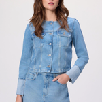 Woman wearing a denim jacket and skirt on a white background