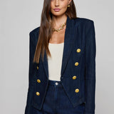Navy structured blazer styled over a simple top.
