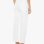 Person wearing white pants on a white background