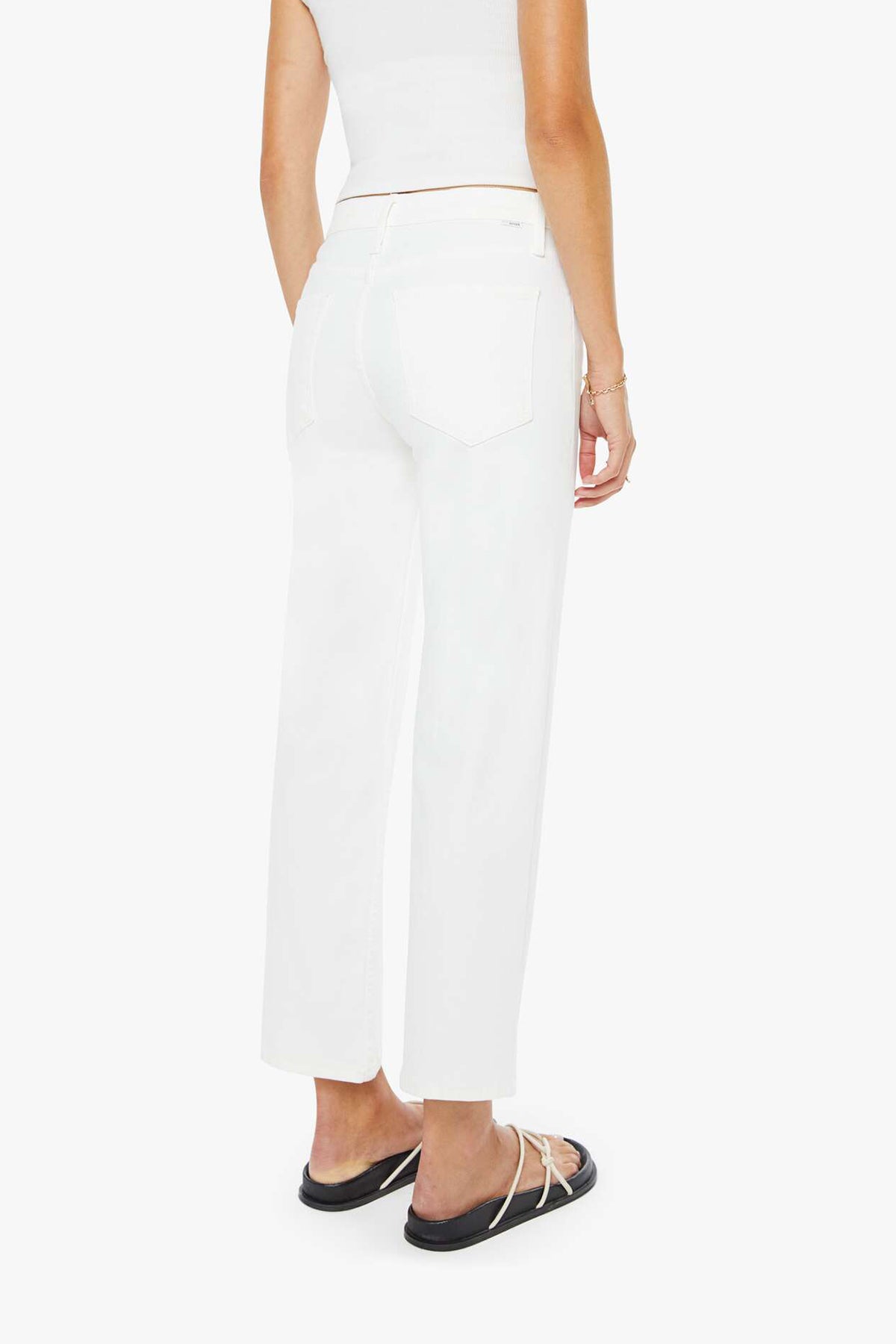 Person wearing white pants on a white background