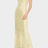 Woman wearing a light yellow sequin dress on a white background