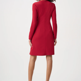 Woman wearing a red dress on a white background