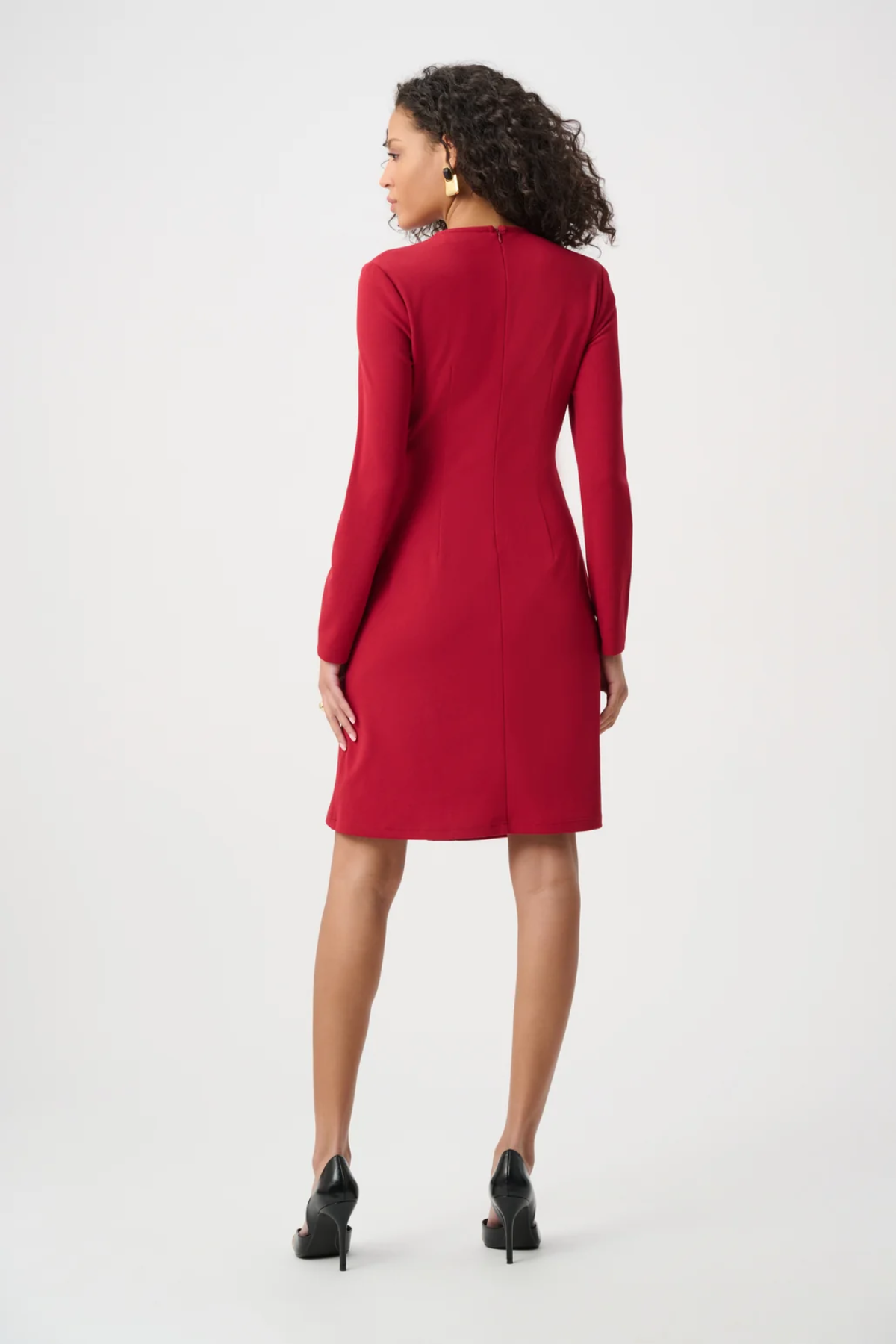 Woman wearing a red dress on a white background