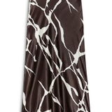 A long satin midi skirt with a brown and white abstract marble or vein-like pattern, shown flat against a white background.