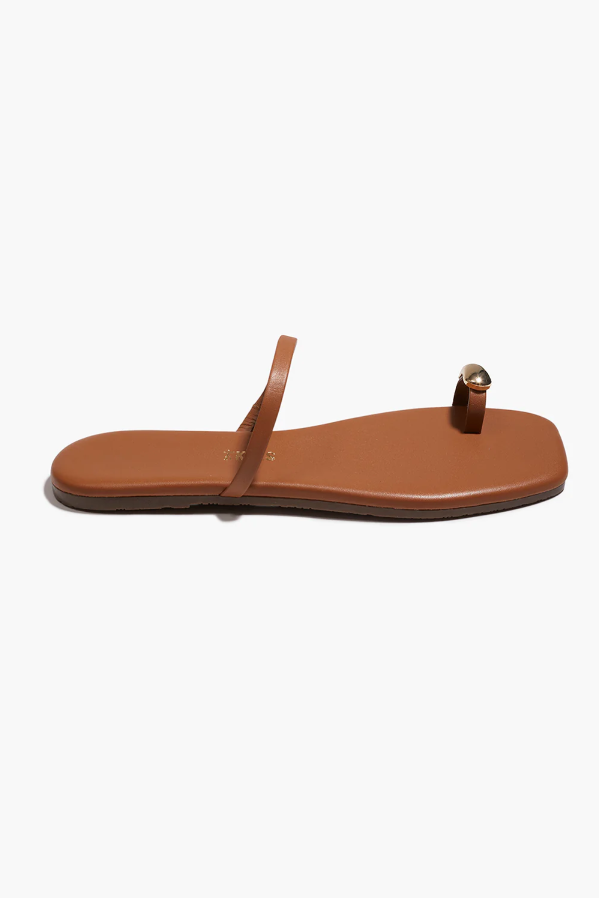 Brown sandal with a single strap on a white background
