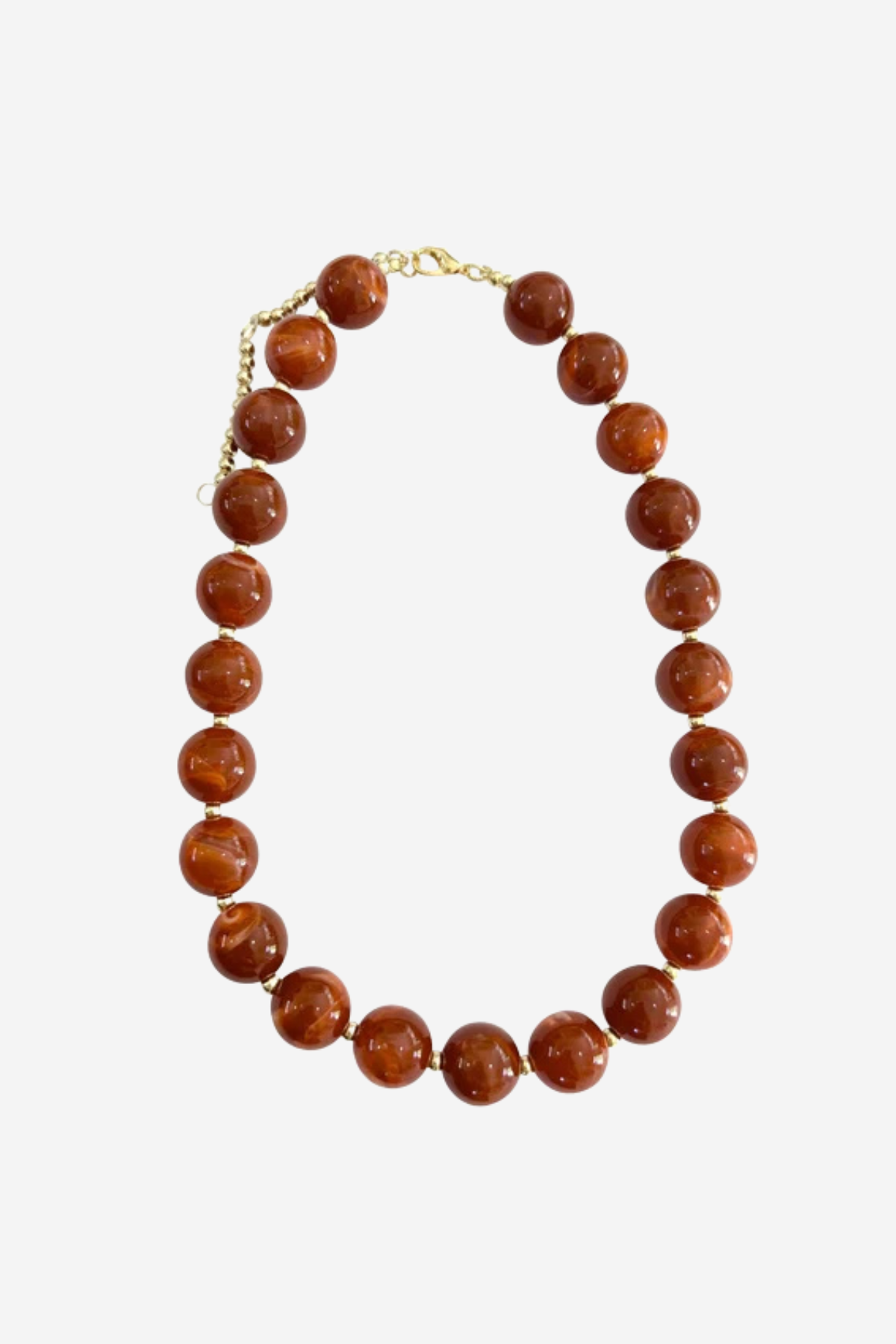 A beaded necklace made of polished round brown gemstone beads with a gold-tone clasp, displayed on a light gray background.