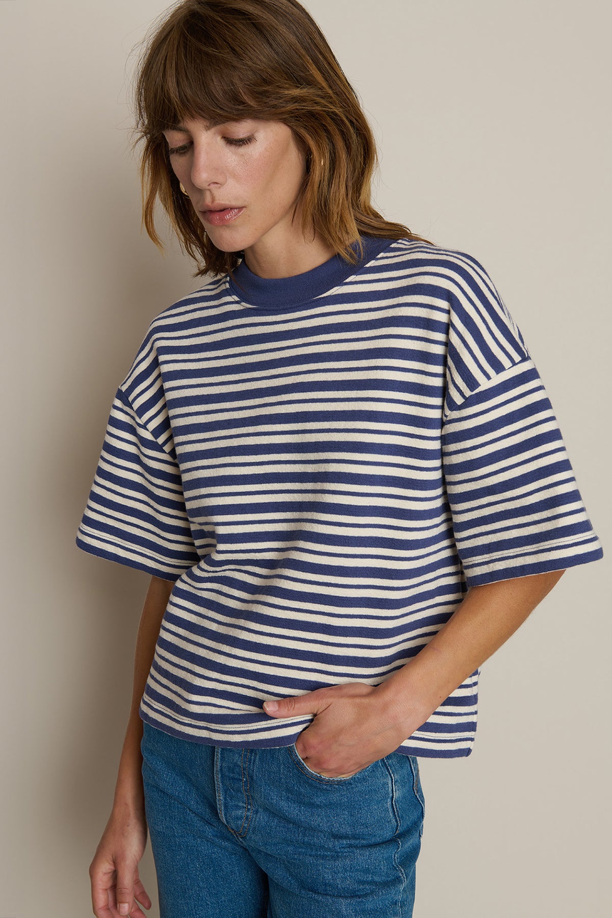 Striped long-sleeve sweatshirt styled with denim