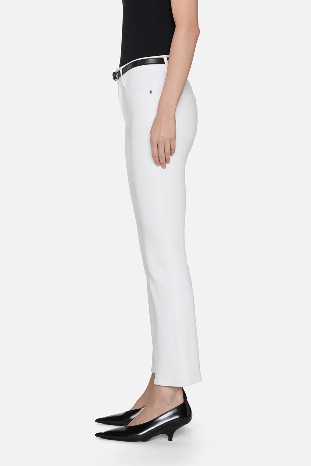 White pants worn by a person on a white background