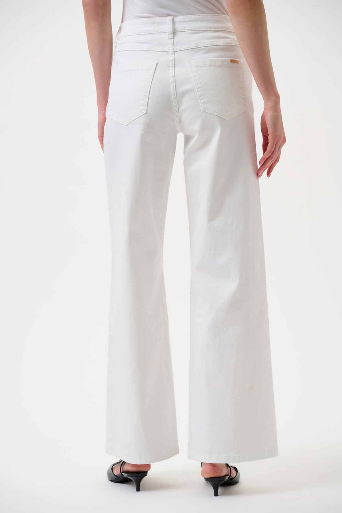 White wide-leg stretch denim jeans with high-rise fit.