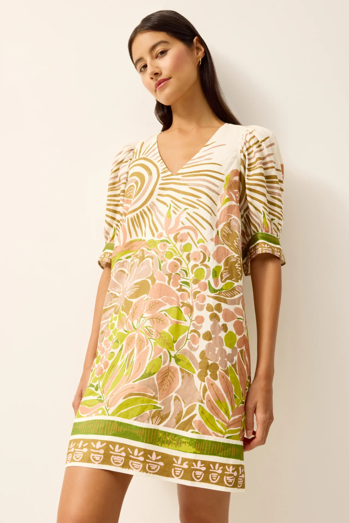 Woman wearing a floral dress with a white background