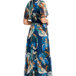 Model wearing a blue printed short-sleeve midi dress featuring a flattering waist and flowing skirt.