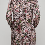Leopard print suit with floral patterns on a plain background