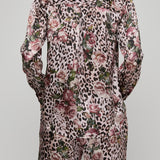 Leopard print suit with floral patterns on a plain background