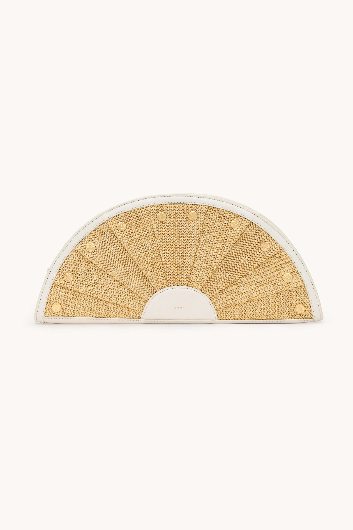 Semicircular woven mat with gold pattern on a white background