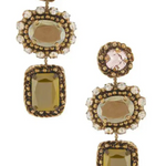 A pair of drop earrings with antique gold-toned metalwork, featuring a round pale pink stone at the top, a rectangular clear crystal halo in the middle, and a larger rectangular olive-green faceted stone at the bottom, shown on a plain white background.