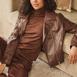 Women's brown biker-style jacket featuring embroidered detailing, long sleeves, and a structured silhouette.
