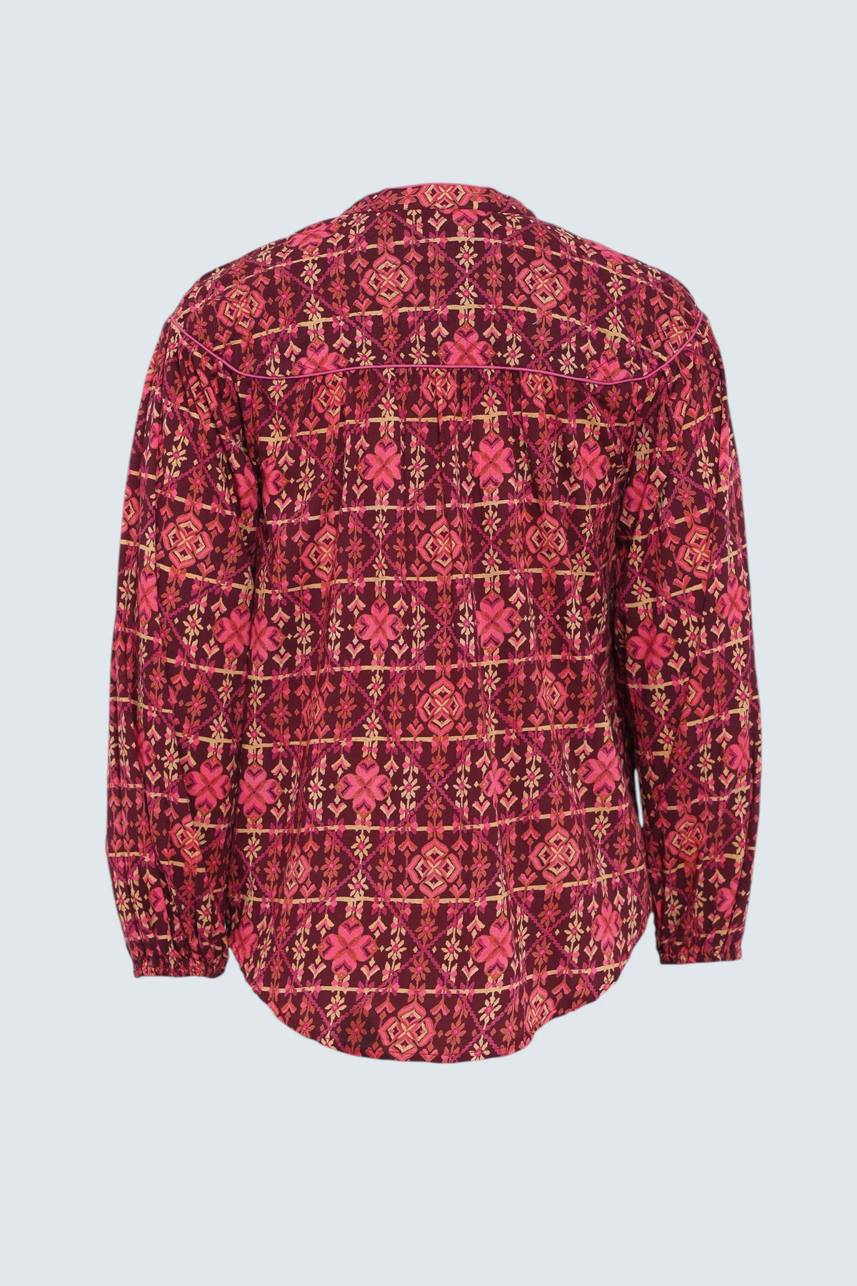 A long-sleeve button-up shirt with a red, pink, and gold geometric pattern, shown from the back against a light gray background.