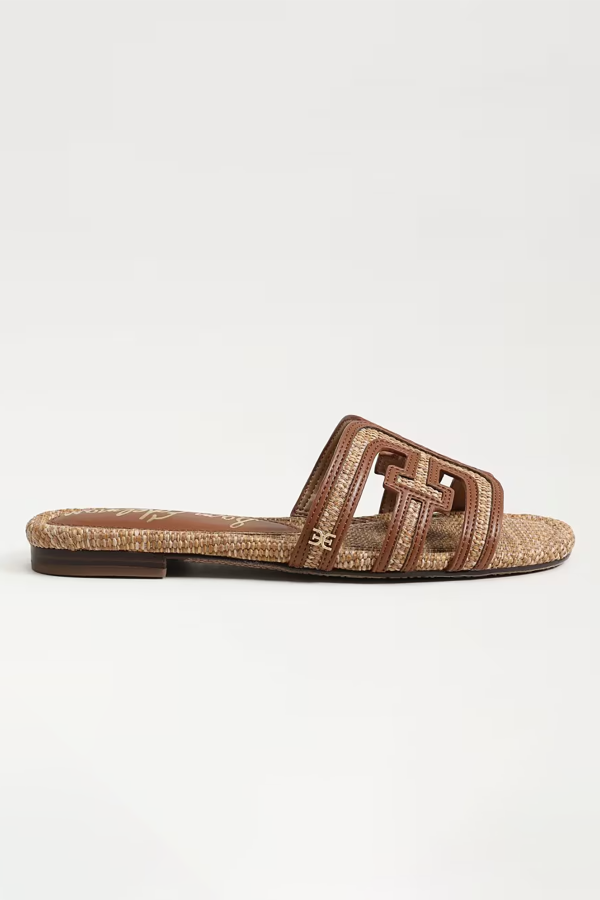 Brown sandal with woven design on a white background