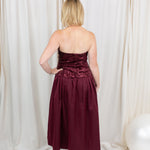 Burgundy sequin dress for evening wear paired with heels
