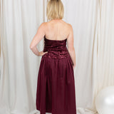 Burgundy sequin dress for evening wear paired with heels