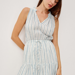 woman in stripe dress on white background 