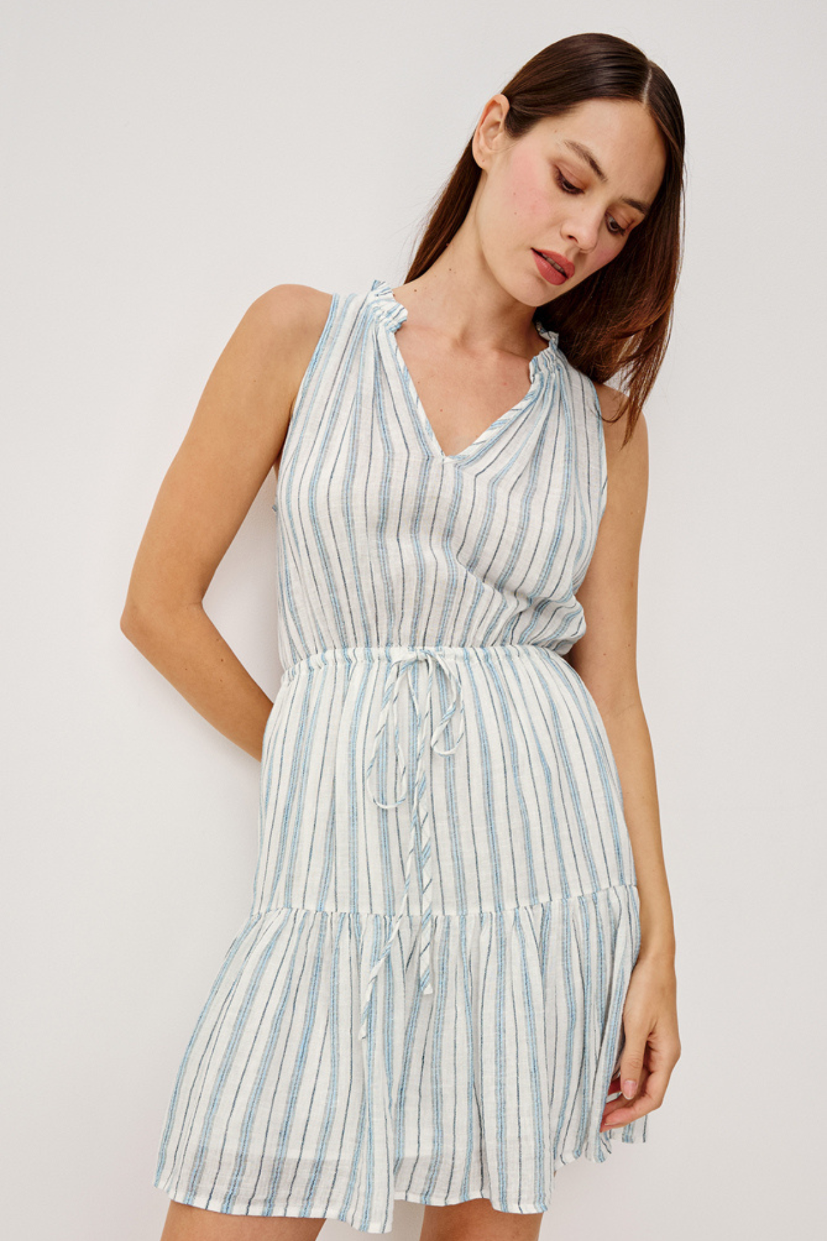 woman in stripe dress on white background 