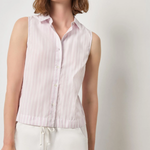 Woman wearing a sleeveless pink striped shirt against a plain background