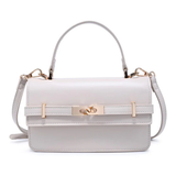 White handbag with gold accents on a white background