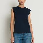 Model wearing a navy sleeveless muscle tank with a relaxed fit.