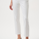 Person wearing white pants on a plain background