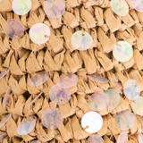Close-up of woven material with embedded round, multicolored sequins.