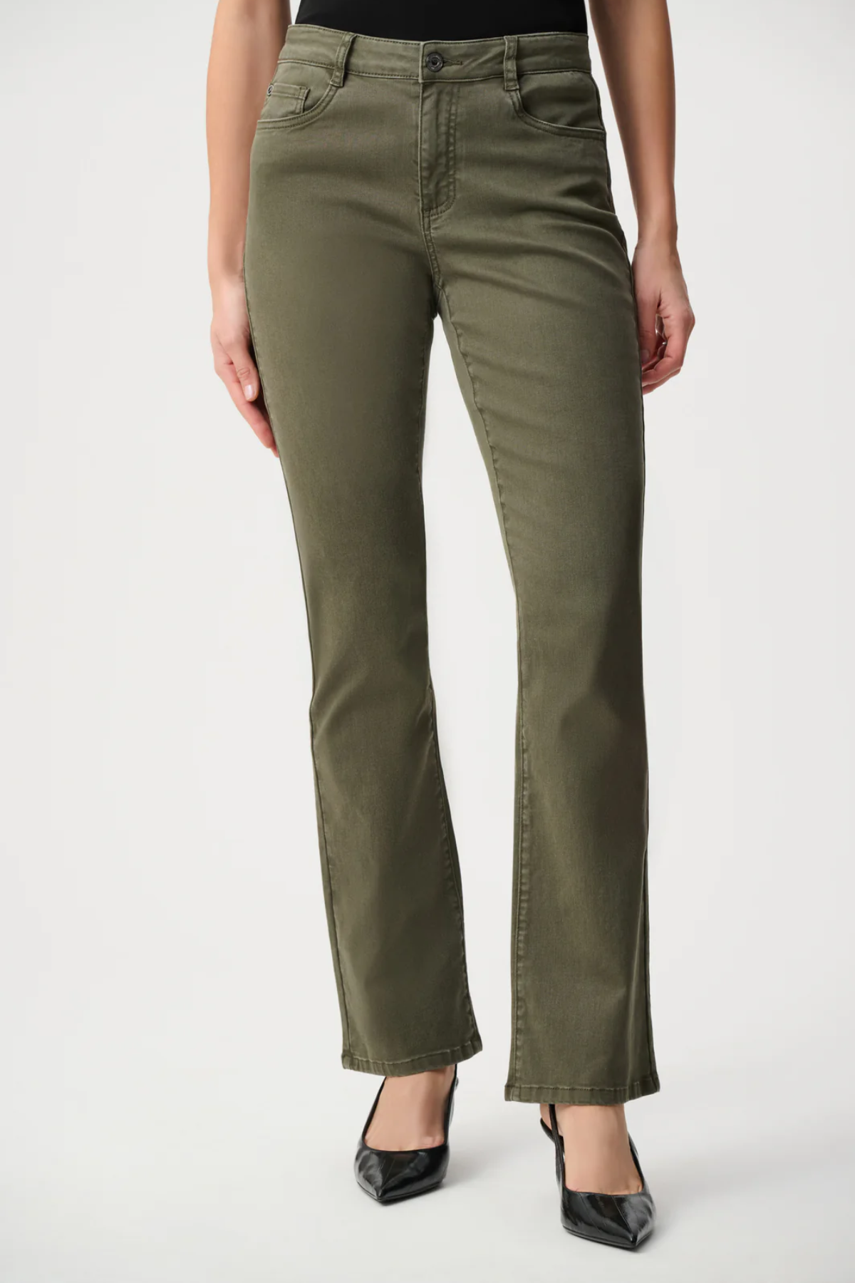 Person wearing olive green pants on a white background