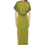 Woman wearing a green dress on a white background