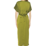Woman wearing a green dress on a white background