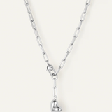 Silver necklace with a heart pendant on a white background