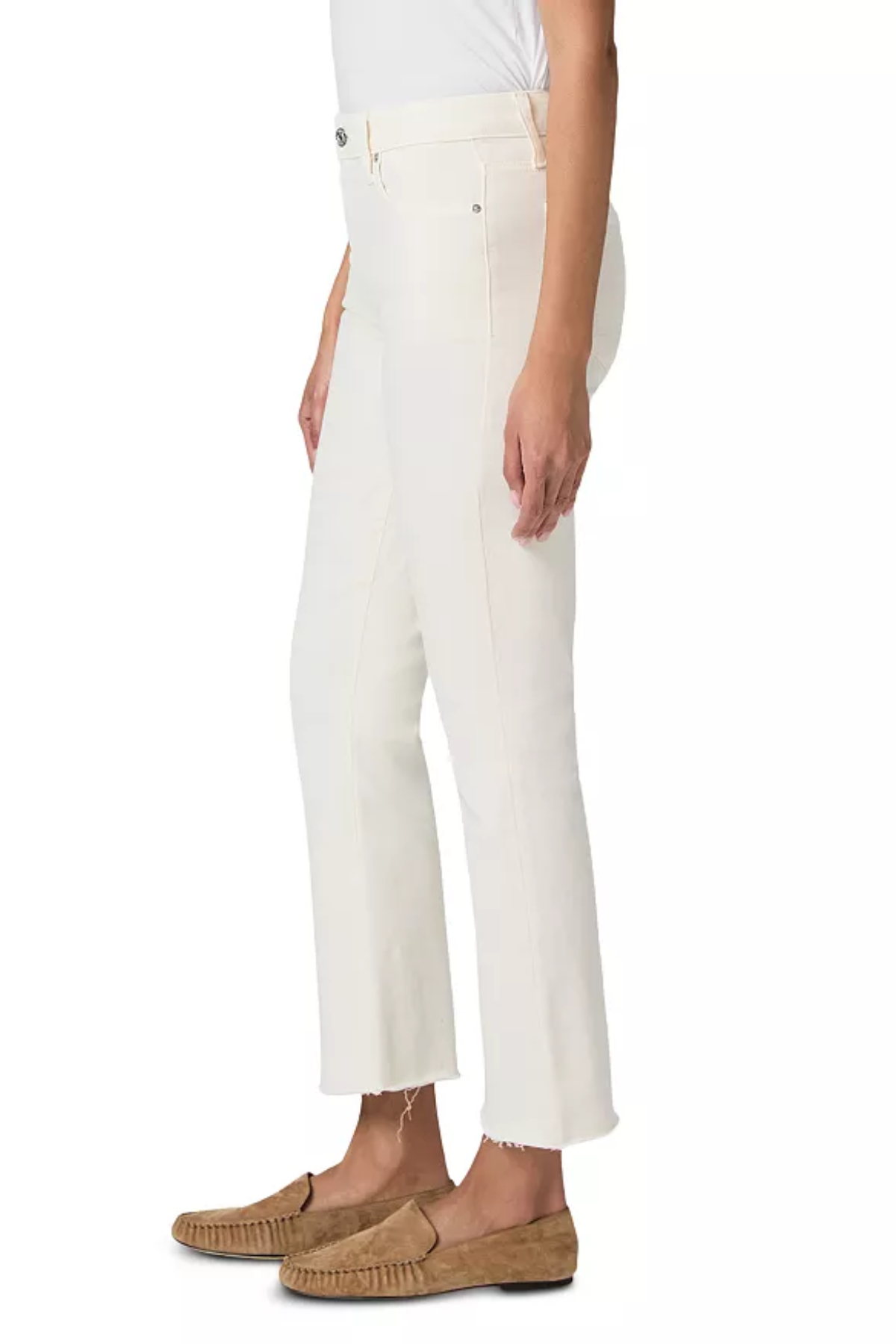 A model shown from the waist down wearing off-white cropped trousers with a frayed hem, paired with tan suede loafers against a plain white background.
