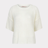 White textured top on a light beige background